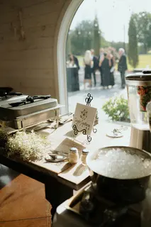 A table with many dishes and pots on it